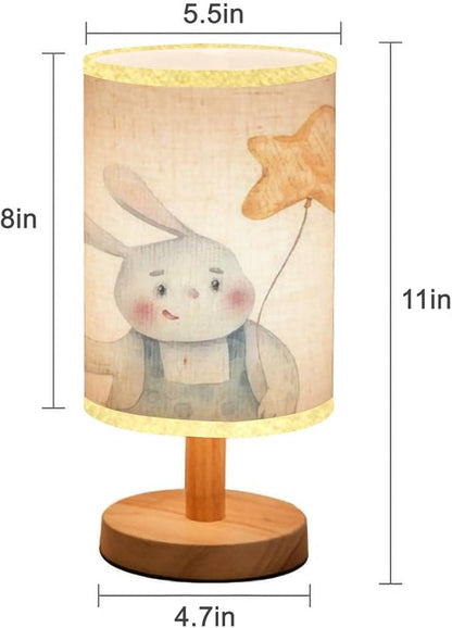 Minimalist Bedside Table Lamp cute childrens bunny holding colored holiday balls in hands holiday Wood Nightstand Lamp Bedside Desk Lamp Wood Base Flaxen Fabric Shade for Bedroom Living Room